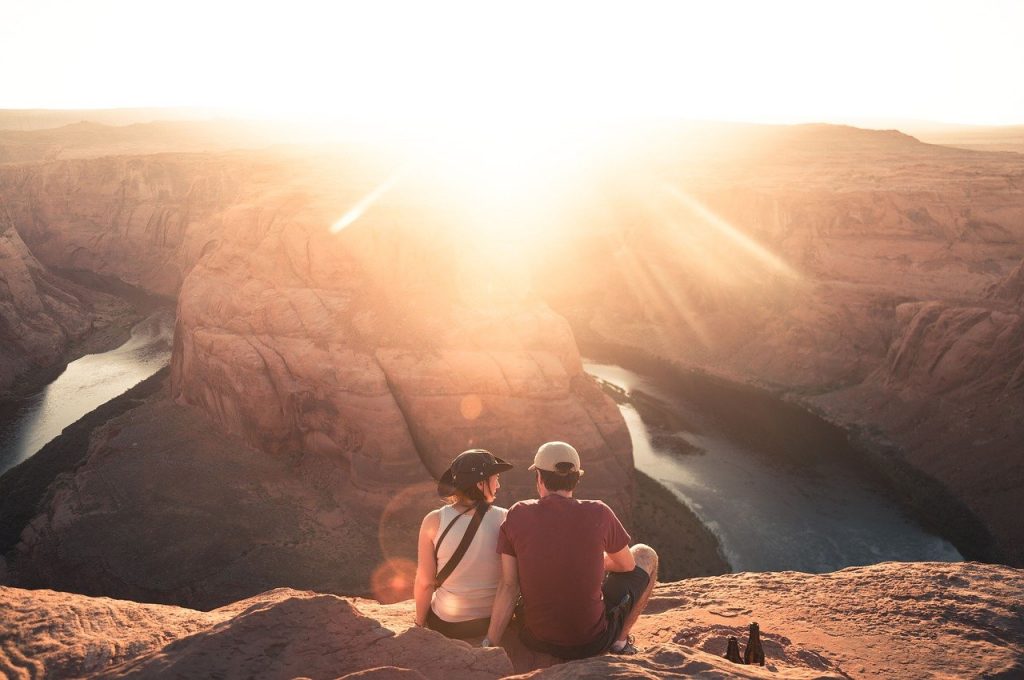 Couple at canyon at sunrise